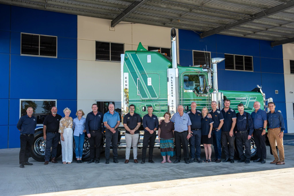 Blenners Transport’s 400th Kenworth, a green T909, with the Blennerhassett family and representatives at the handover