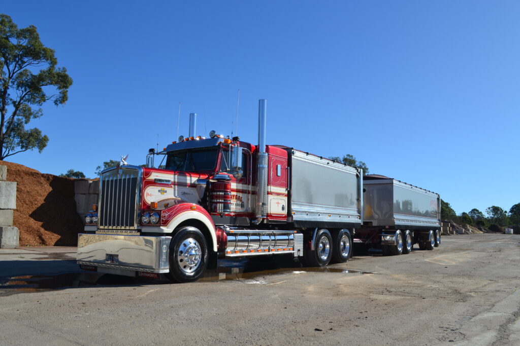 Red and silver Raygal Kenworth T900 Legend with tipper and dog trailers