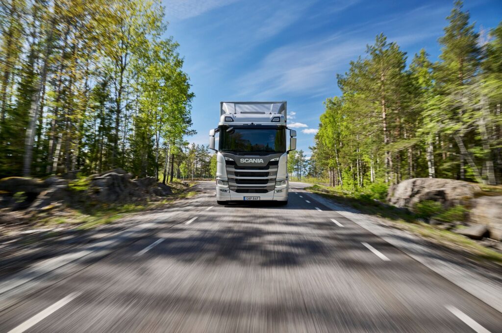 Scania R-series truck driving on a road