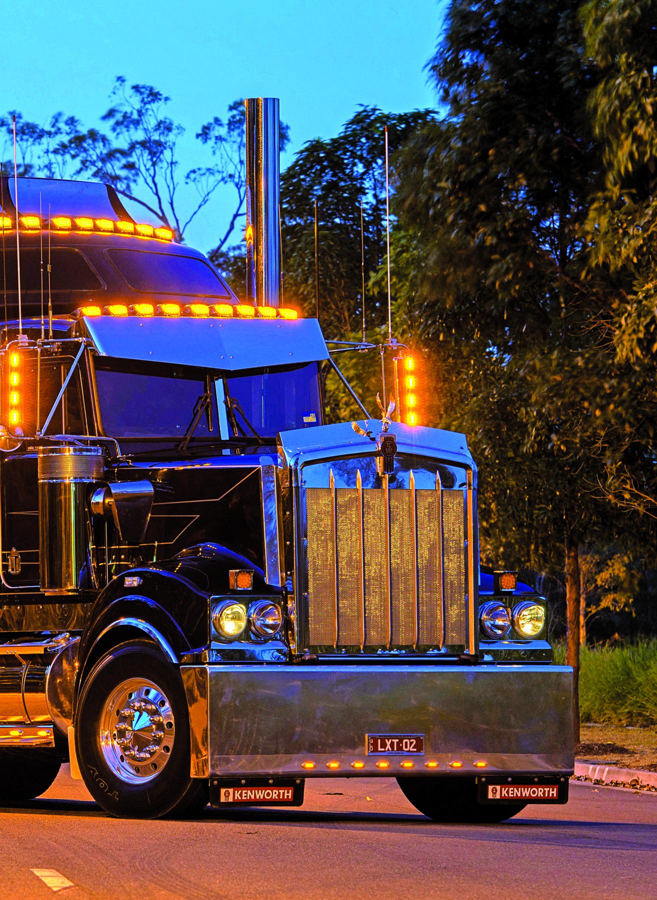 Front of Bill Long’s Kenworth T900 photographed at dusk with marker lights on