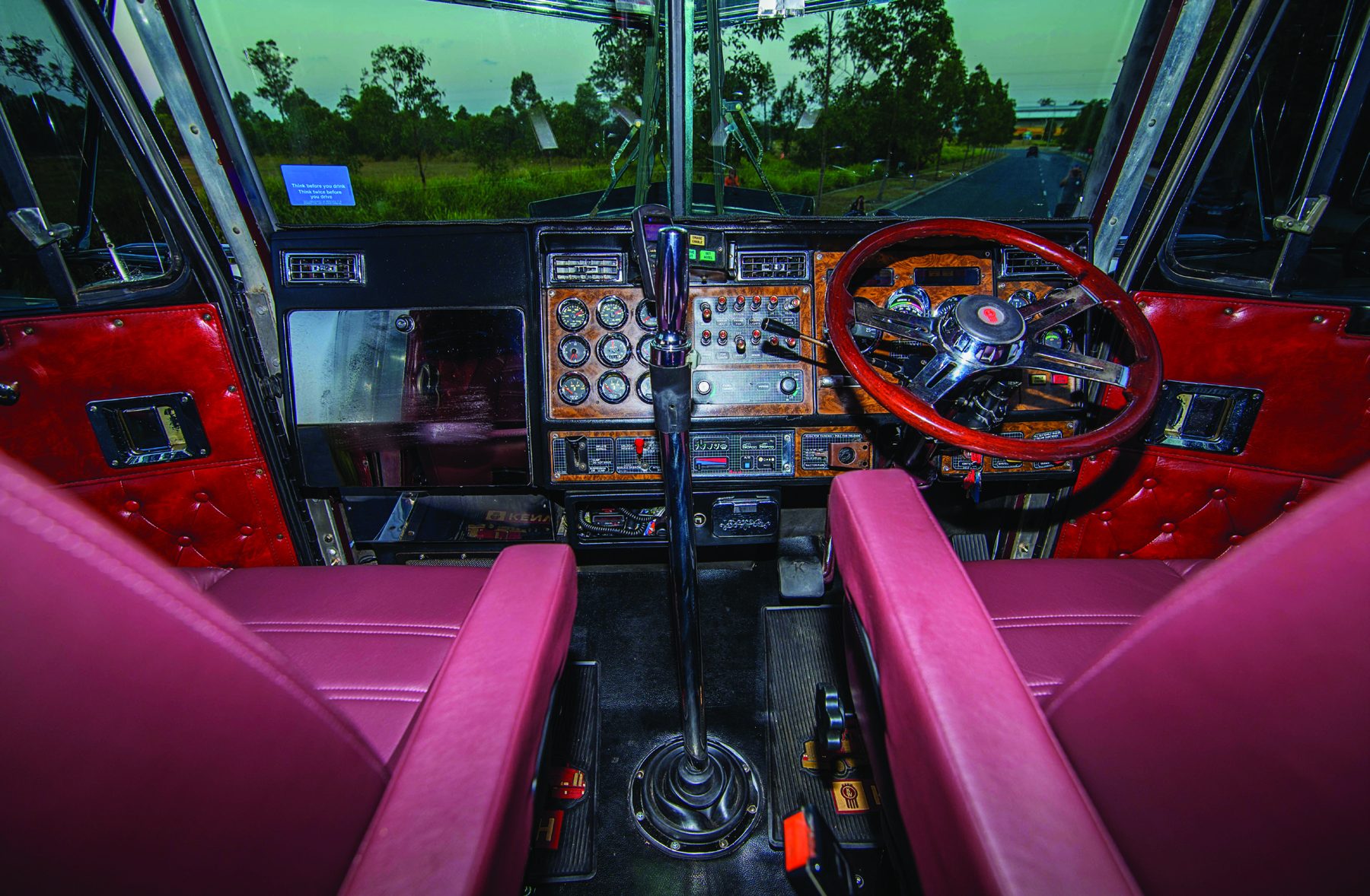 Custom red interior and right-hand-drive dashboard of Bill Long’s Kenworth T900