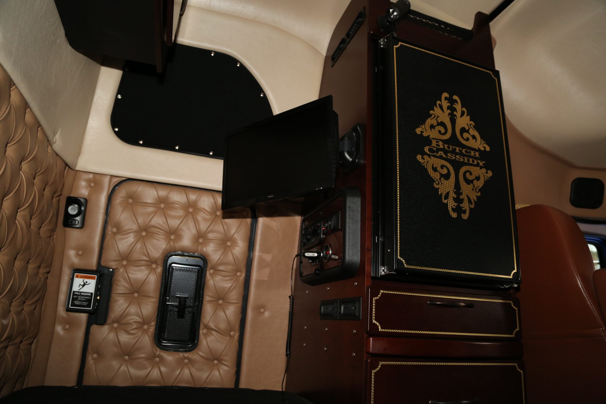 Leather-lined sleeper in HHA’s Western Star Butch Cassidy, with a television and storage cabinets