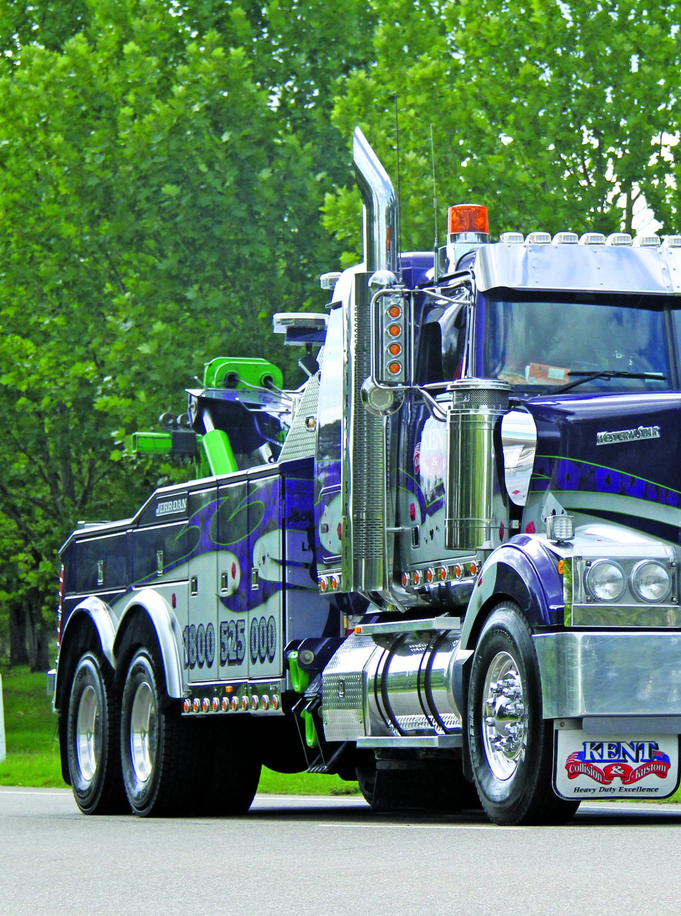 Front of the purple Kent Collision & Kustom Western Star tow truck