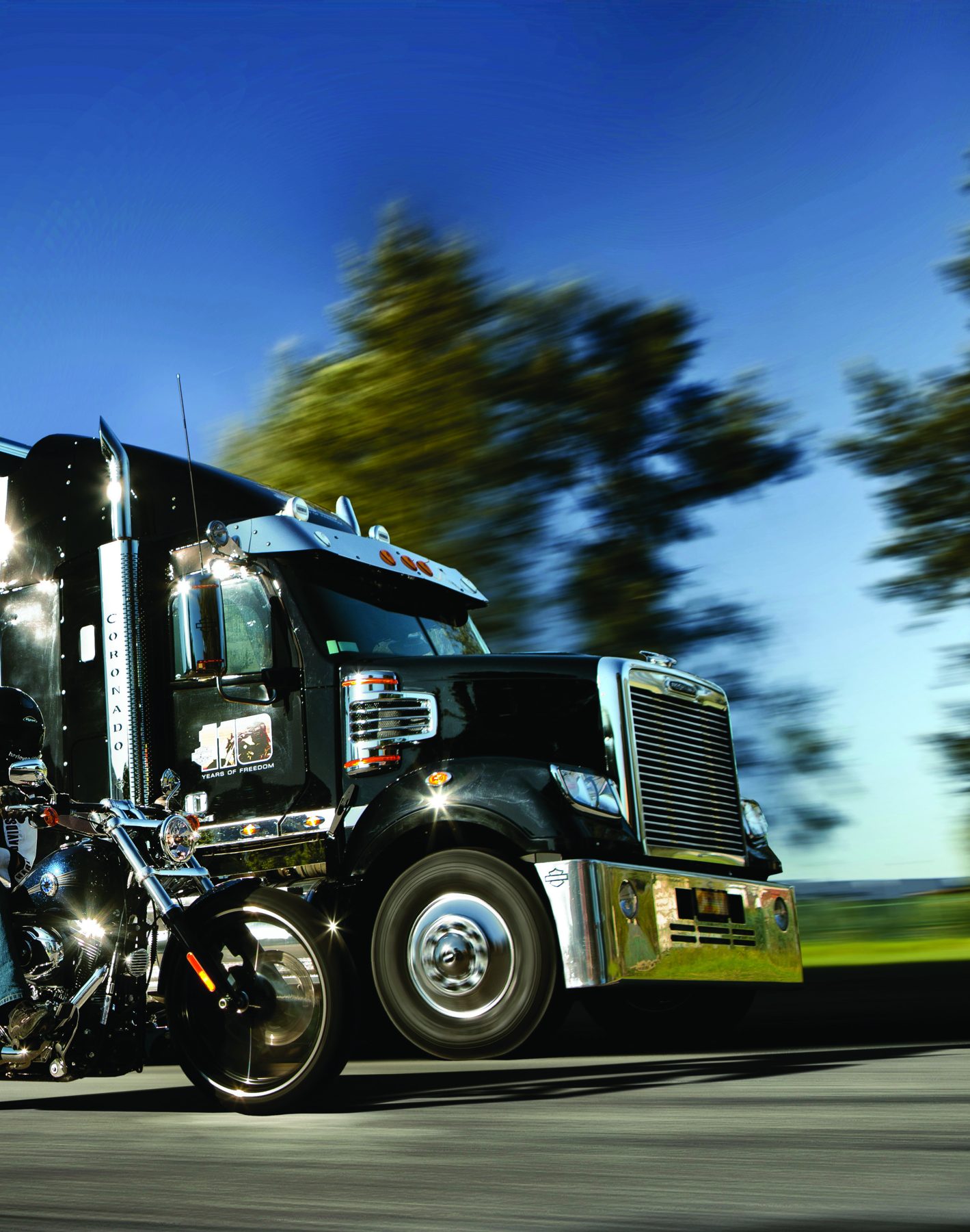 Black Harley-Davidson Freightliner Coronado driving on the road