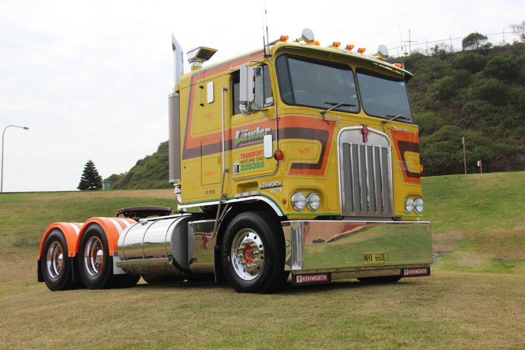 Steve Lawler’s restored yellow and orange 1983 Kenworth cab-over on display after SLS custom work