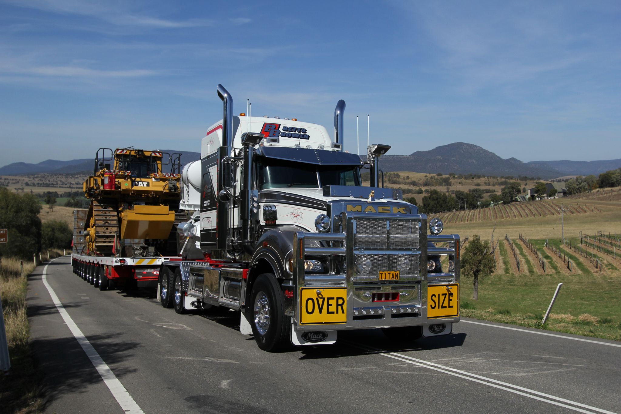 Betts Bower Haulage Mack Titan hauling a Caterpillar machine after SLS customisation