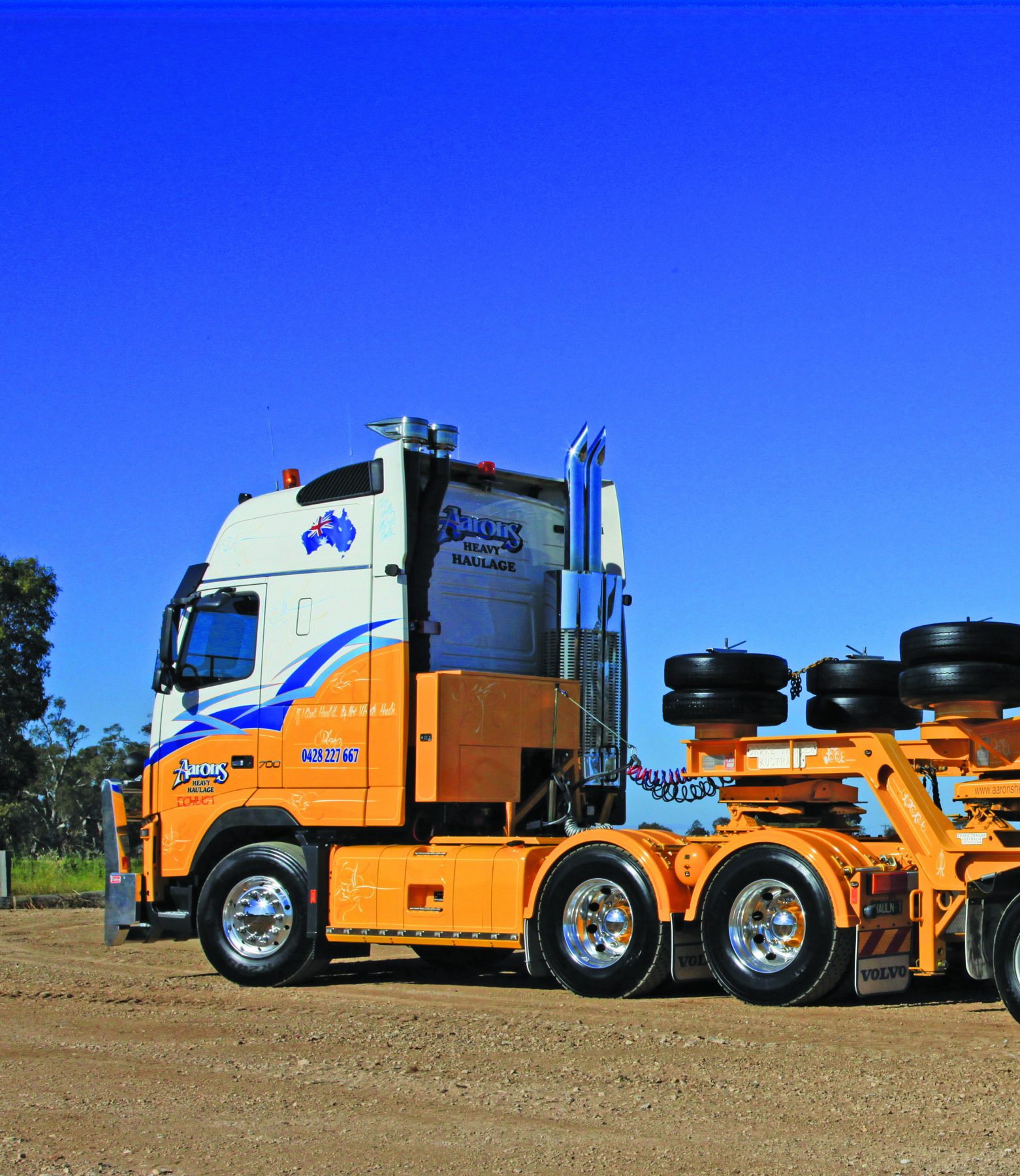 Side view of Aaron’s Volvo and excavator load