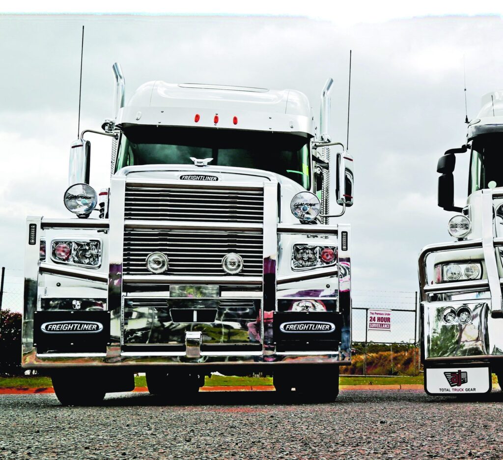 Front of a white Freightliner fitted with a polished AJ’s bullbar